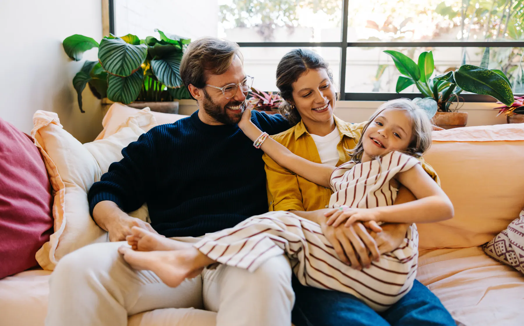A family relaxing together, representing Top Gum Dental's Parker, SD office